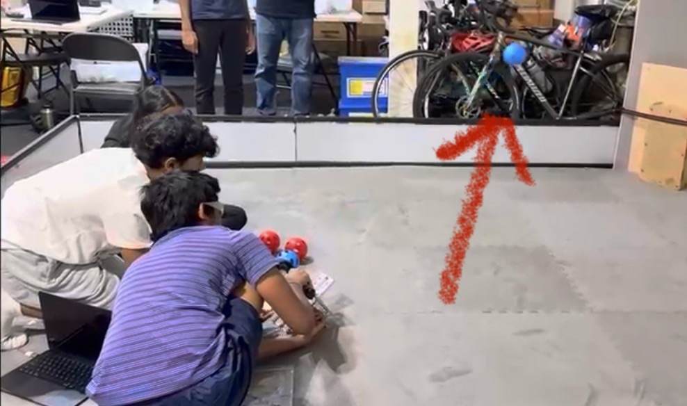 Team members testing the robot